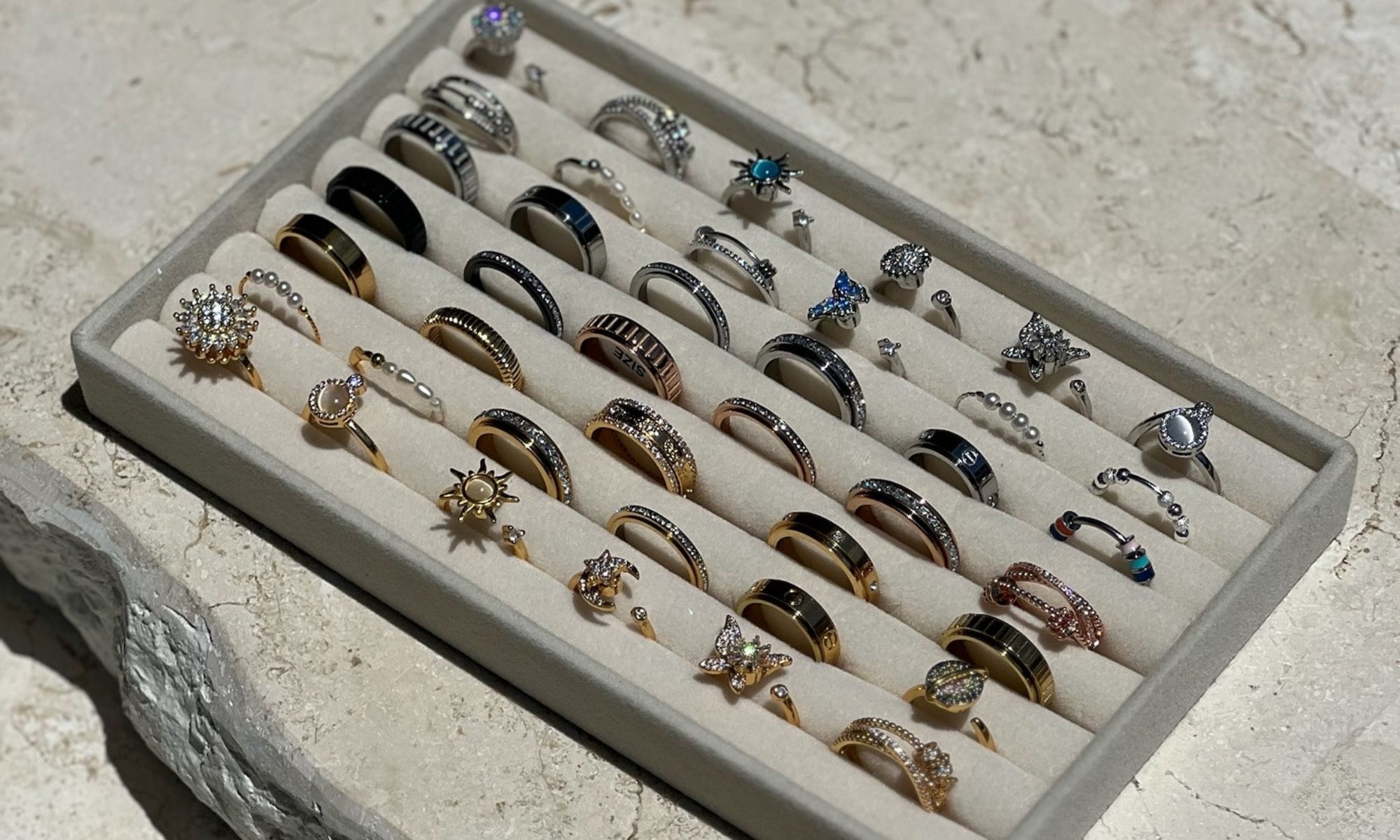 A hand styled with Worry Rings wellness jewellery