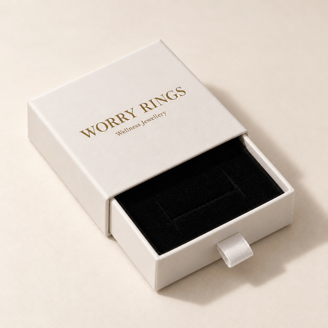 White Worry Rings jewellery box with gold branding, a black insert and ribbon drawer pull